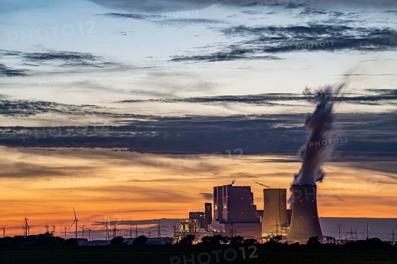 The RWE lignite-fired power plant Neurath, near Grevenbroich, largest German coal-fired power plant, second largest in Europe, Block F-G, wind farm, sunset, North Rhine-Westphalia, Germany, Europe