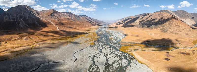 Aerial view, Burkhan mountain valley with meandering river, barren dramatic mountain landscape, Terskey Ala-Too, Tien Shan, Issyk Kul province, Kyrgyzstan, Asia