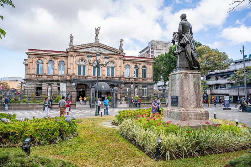 National Theatre of Costa Rica and Parque Juan Rafael Mora Fernández square with statue, San José, Costa Rica, Central America