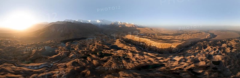 Panorama, White glaciated and snow-covered mountain peak Pik Lenin at sunrise, hilly landscape with golden meadows and lakes, aerial view, Trans Alay Mountains, Pamir Mountains, Osh Province, Kyrgyzstan, Asia