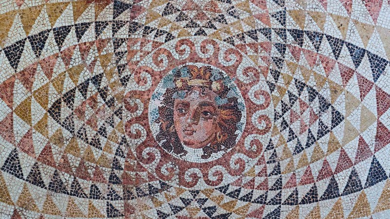 Head of Dionysus with fruit and ivy in his hair, finely worked antique mosaic with a centred portrait, Archaeological Museum, Archea Korinthos, Corinth, Peloponnese, Greece, Europe