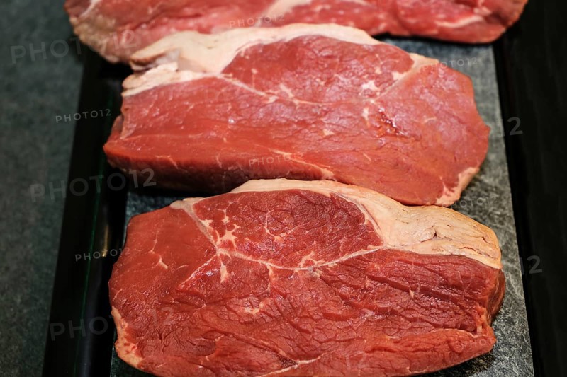 Raw roast beef on a platter