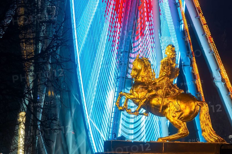 Augustus Market in Dresden. Equestrian statue of Augustus the Strong, also known as the Golden Horseman, with a Ferris wheel turning behind it, Dresden, Saxony, Germany, Europe