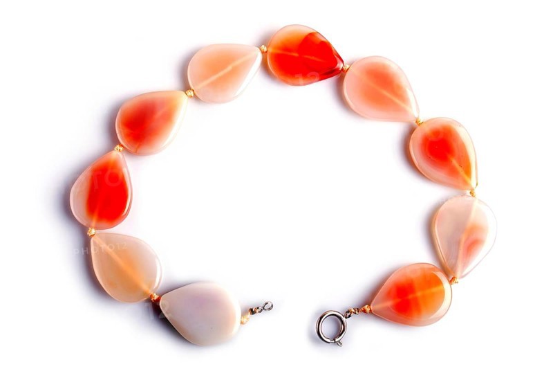 Agate colored beads isolated on white background. top view, close up