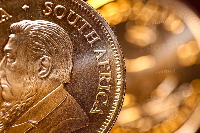 Close-up of two Krugerrand gold coins