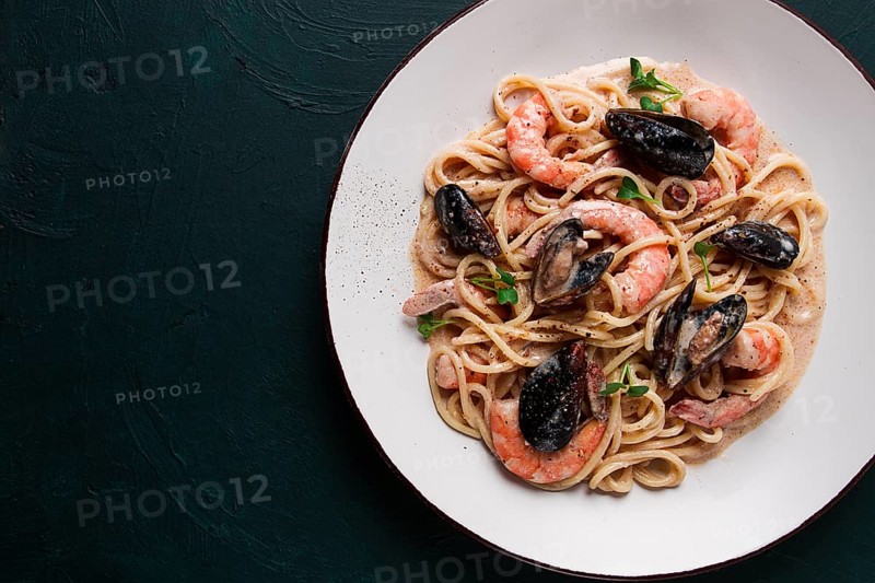 Spaghetti, pasta, with seafood, shrimp with mussels, in creamy garlic sauce, homemade, no people