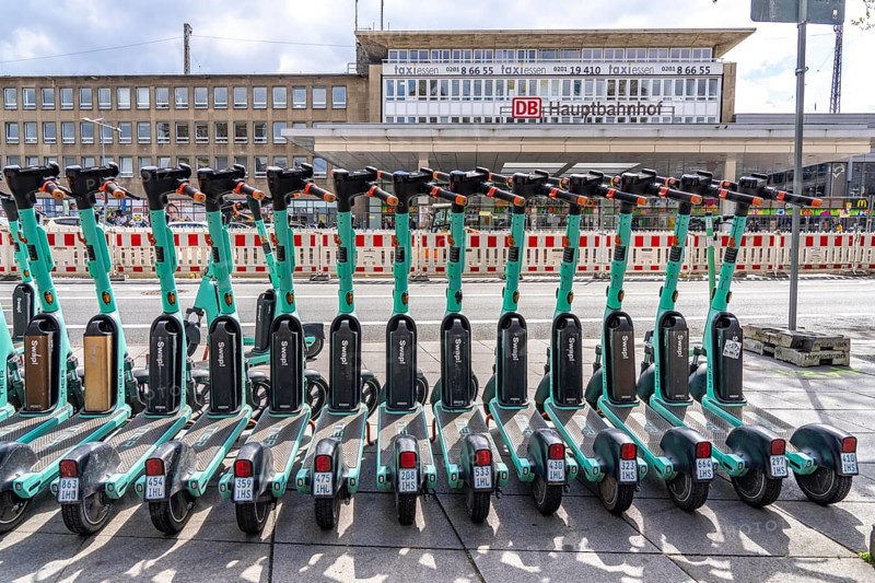 Parking space for e-scooters at the main railway station, provider Tier, in e-scooter sharing with Ruhrbahn, Essen, North Rhine-Westphalia, Germany, Europe
