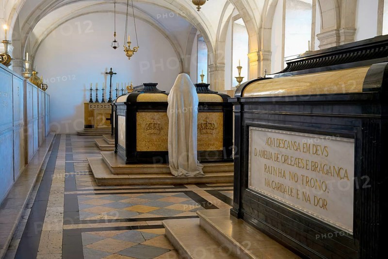 Monastery of Sao Vicente de Fora, Royal Pantheon of the Braganca family, Sculpture of a woman praying in front of the tomb of Carlos I, Lisbon, Portugal, Europe