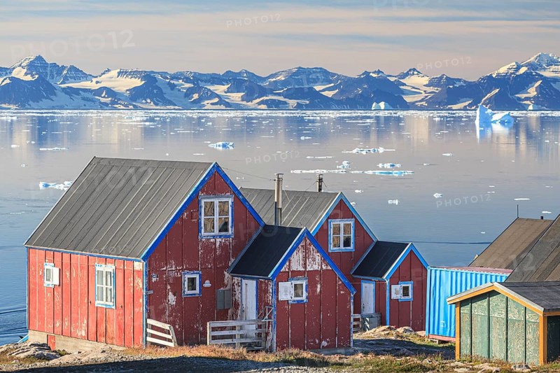 Typical Greenlandic house in an Inuit settlement on a fjord off Bergen, sunny, Ittoqqortoormiit, Scoresby Sund, East Greenland, Greenland, North America