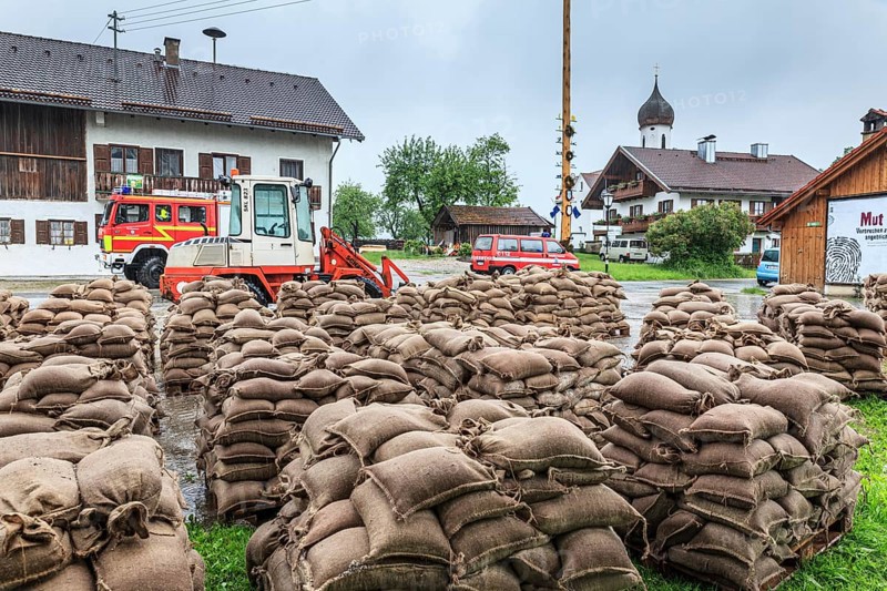 Sandbags, continuous rain, high water, flooding, fire brigade, town, houses, Whitsun floods 2013, climate change, Schlehdorf, Alpine foothills, Bavaria, Germany, Europe