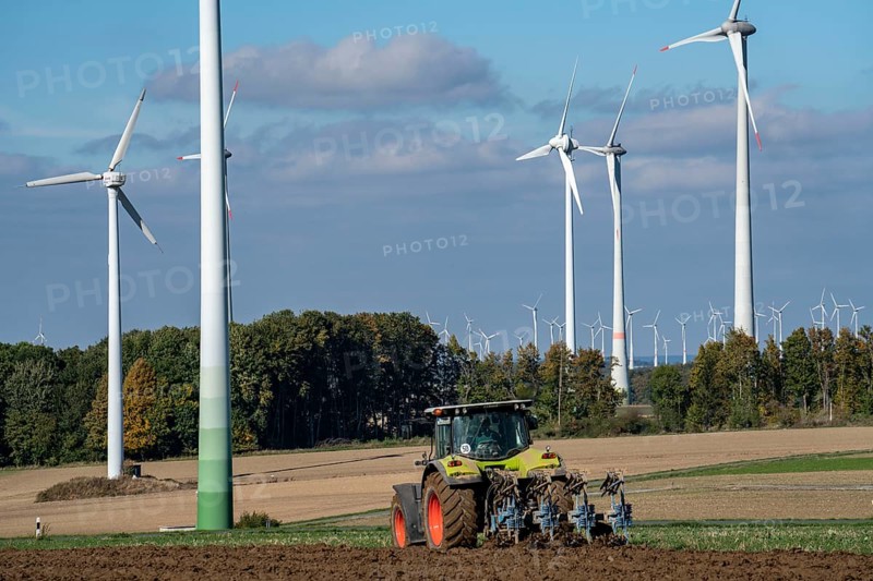 Farmer working in the fields, with a tractor, wind farm above the village of Lichtenau, self-proclaimed energy town, Paderborn district, OWL, A North Rhine-Westphalia, Germany, Europe