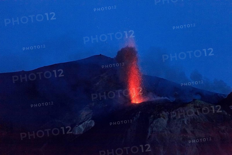 Italy, Sicily, Aeolian Islands, Tyrrhenian Sea, San Vincenzo, summit of Stromboli volcano 924 m, eruption of lava and projection of volcanic bombs from the central craters, Europe