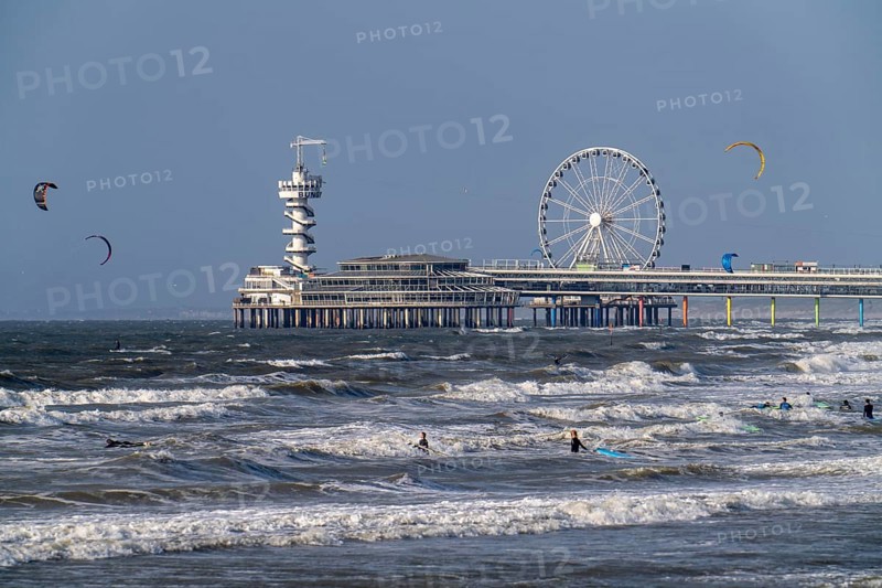 View over the beach of Scheveningen, the pier with Ferris wheel belongs to the city of The Hague and is the largest seaside resort in the Netherlands