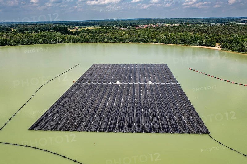 Germany's largest floating solar power plant on the Silbersee III, a quarry pond no longer used for sand mining, near Haltern am See, operated by Quarzwerke GmbH, around 5800 solar modules, on an area of a good 2 football pitches, generate 3.1 megawatts of power, the company uses the electricity itself on weekdays, at weekends it flows into the public grid, North Rhine-Westphalia, Germany, Europe