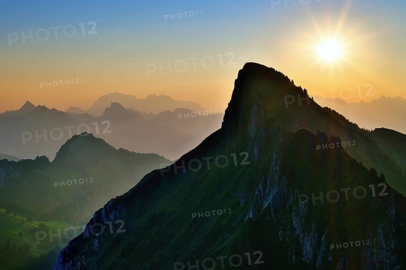 Tierberg at sunrise, behind it the Appenzell Alps with Alpstein and Säntis, cantons of Glarus and St. Gallen, Switzerland, Europe