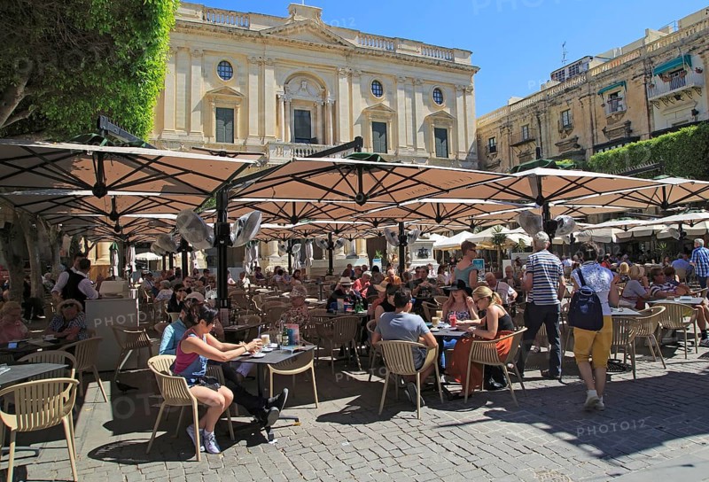 National Library building people at cafes in Republic Square, Valletta, Malta, Europe