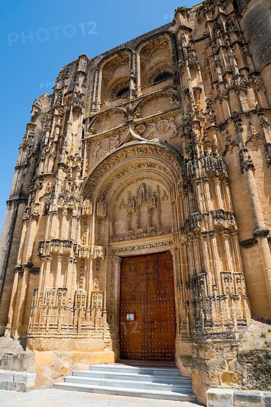 Impressive Gothic church façade with ornately carved portal and massive stone doors, Basilica Santa María de la Asunción, Church of Santa Maria de la Asuncion, Arcos de la Frontera, Cádiz province, Cadiz, Andalusia, Spain, Europe