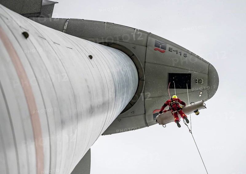 Height rescuers from the Oberhausen professional fire brigade practise abseiling from a wind turbine from a height of 150 metres, rescuing an injured person, technician, from the nacelle, Issum, North Rhine-Westphalia, Germany, Europe