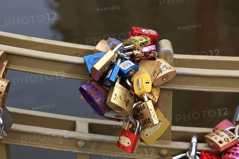 Lover's lock on a railing, love lock is a padlock which, according to custom, is attached to bridges by lovers to symbolically seal their eternal love, Prague, Czech Republic, Europe