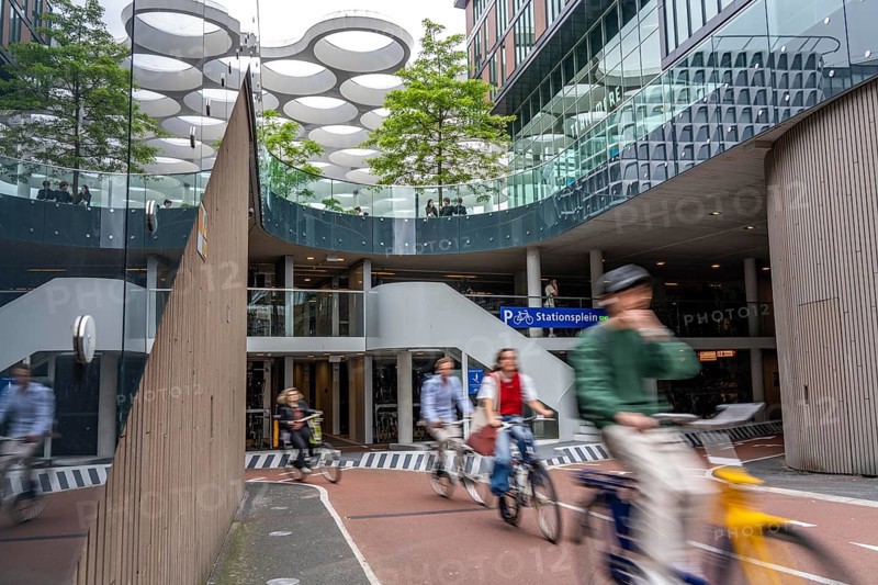 Entrance and exit of the bicycle car park at Utrecht Centraal station, Stationsplein, over 13, 000 parking spaces, considered the largest bicycle car park in the world, over 3 underground floors, Utrecht, Netherlands