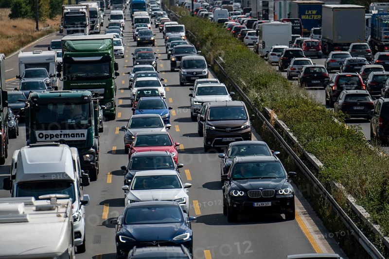 Traffic jam on the A3 motorway, over 8 lanes, in both directions, between the Leverkusen motorway junction and the Cologne-Mülheim junction, looking south, Friday afternoon heavy traffic, delays due to the traffic jam, Leverkusen, North Rhine-Westphalia, Germany, Europe