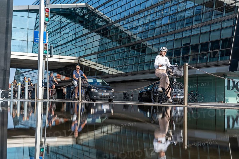 Cyclists on the cycle path on Christians Brygge Street, at the Black Diamond, Danish Royal Library, Copenhagen is considered the cycling capital of the world, 45 % of the population travel by bike, Denmark, Europe
