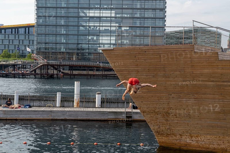 Summer, swimming in the harbour of Copenhagen, there are official bathing places, harbour baths and lidos in many places, here at Havnebadet Islands Brygge, Denmark, Europe