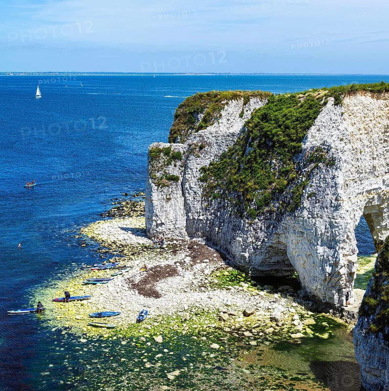 People on paddleboards, White Cliffs. Old Harry Rocks Jurassic Coast, Dorset Coast, Poole, England, United Kingdom, Europe