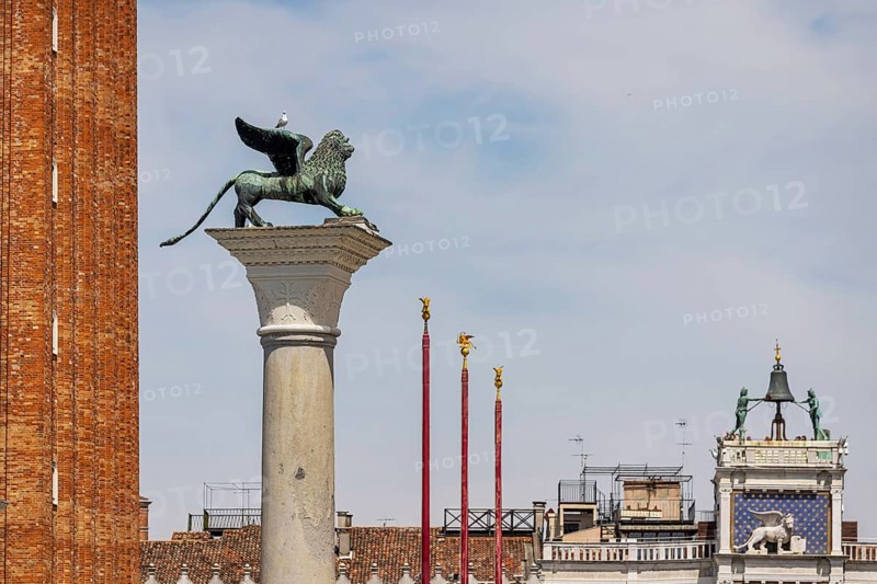 View of the city from the Canale della Giudecca, granite column on St Mark's Square with the Lion of Venice, Venice, Italy, Europe