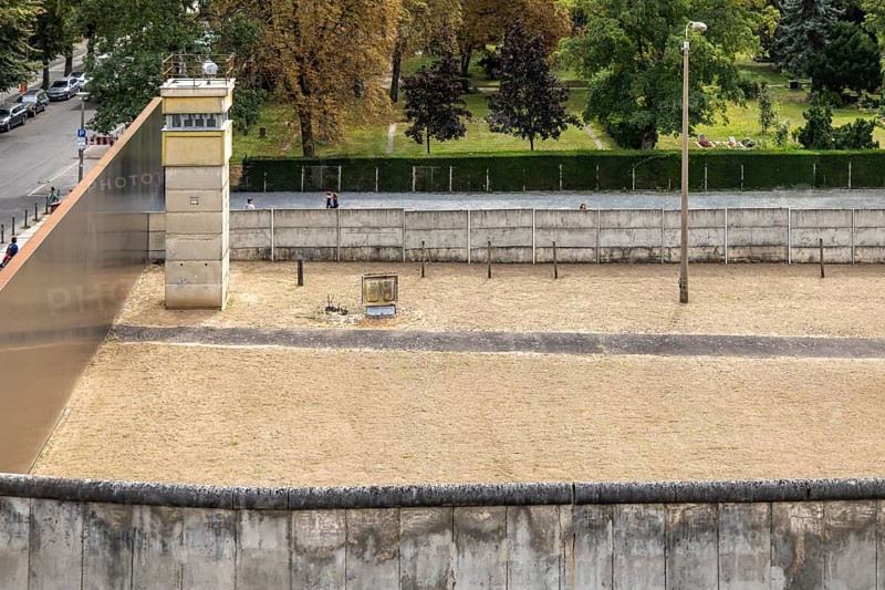 Berlin Wall Memorial, sight and reminder of the division by the Berlin Wall and of the fatalities at the border. Original preserved border strip with watchtower on Bernauer Strasse, Berlin, Germany, Europe