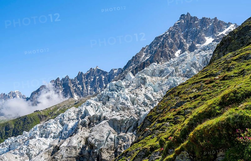 Glacier ice of the Glacier des Bossons with summit of the Aiguille du Midi, Chamonix, Haute-Savoie, France, Europe