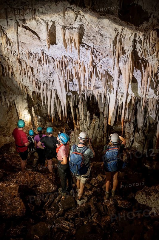 Visitors in a stalactite cave, tourists looking at stalactites in the Terciopelo Cave, Barra Honda National Park, Costa Rica, Central America