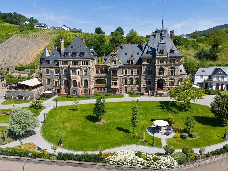 Historic castle with well-tended garden, surrounded by green hills under a blue sky in summer, aerial view, Lieser Castle, Lieser, Moselle, Bernkastel-Kues, Rhineland-Palatinate, Germany, Europe