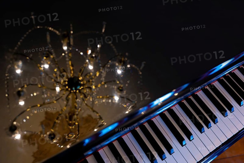 Crystal Lamp Reflected on a Piano in Switzerland