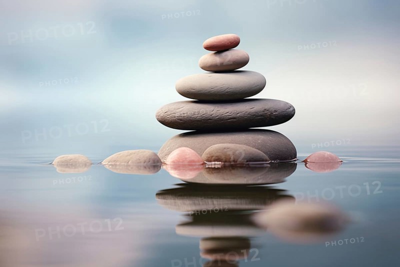 Stack of zen stones on water with a nature background. The image conveys a sense of balance, harmony, and peace. Suitable for use in wellness, therapy, and relaxation concepts, AI generated