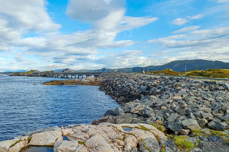 Bridge connecting rocky shores under a cloudy sky, autumn, Atlantic Road, Atlanterhavsveien, Romsdal, Norway, Europe