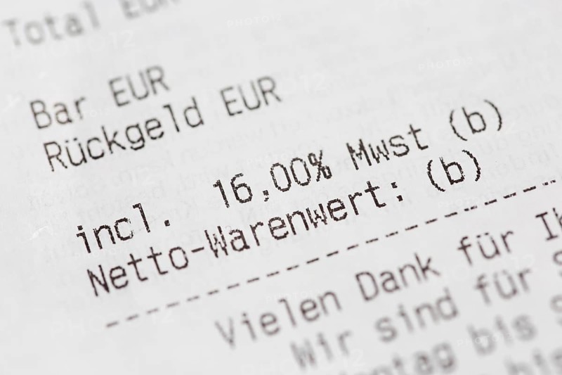 Close-up of a till receipt showing the reduction in VAT to sixteen per cent in Germany due to the coronavirus crisis
