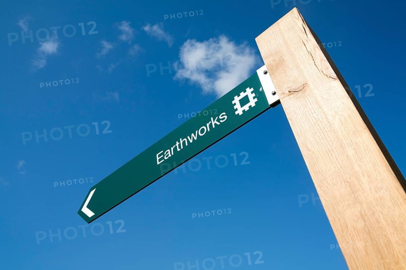 English Heritage signpost arrow for the Neolithic Hatfield earthworks site at Marden, Wiltshire, England, United Kingdom, Europe