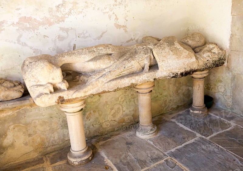 Stone effigy of knight in porch of Church of Saint Michael and All Angels, Figheldean, Wiltshire, England, UK