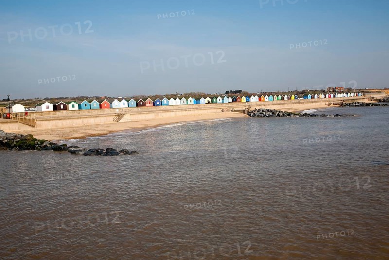 Colourful beach huts line the promenade at Southwold, Suffolk, England, United Kingdom, Europe