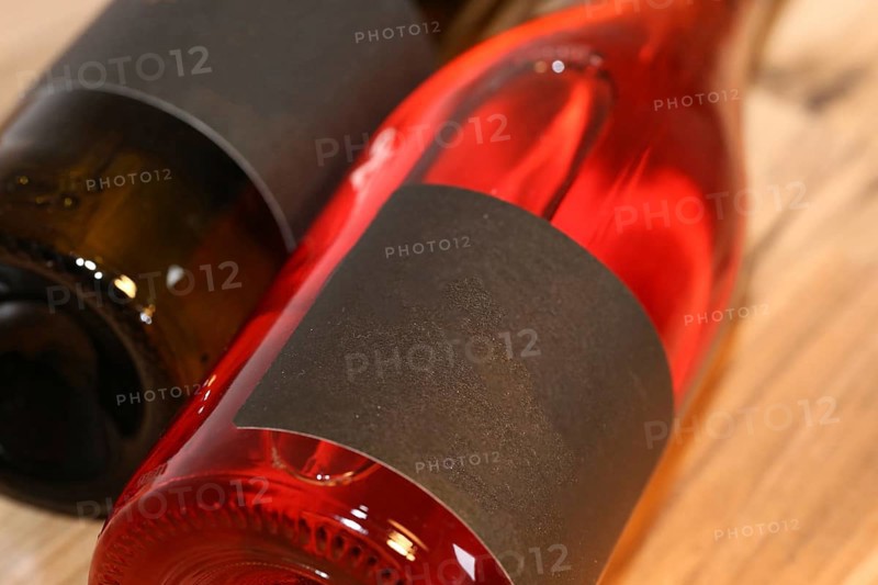Close-up of two horizontal wine bottles