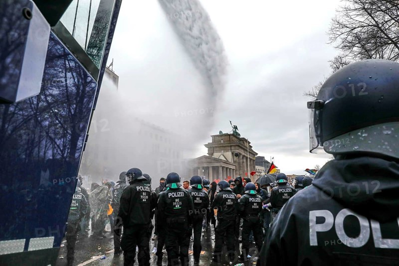 Water cannon in use at the Brandenburg Gate. Once again, thousands of corona deniers are demonstrating against the restrictions in the pandemic. The police broke up the demonstration for not observing social distancing rules and not wearing face masks, Berlin, 18 November 2020