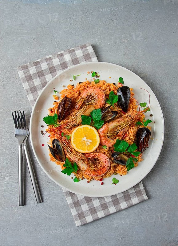 Seafood paella, shrimp and mussels risotto, rice, homemade, top view, no people