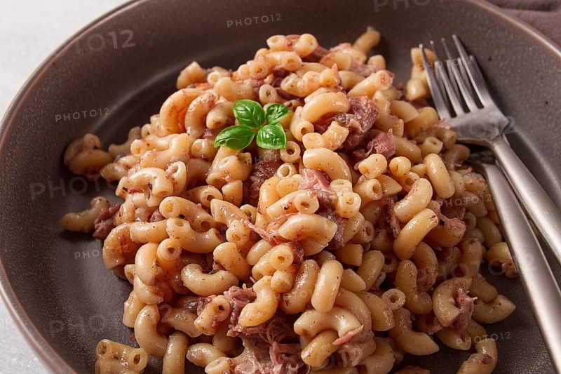 Pasta with stewed meat, pasta in the navy, horns, homemade, no people