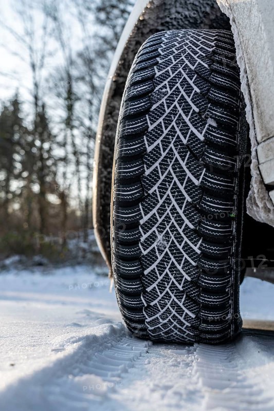Winter tyres, driving on a road with snow cover, grip on the snow thanks to the special tread and rubber compound, the tyre for winter