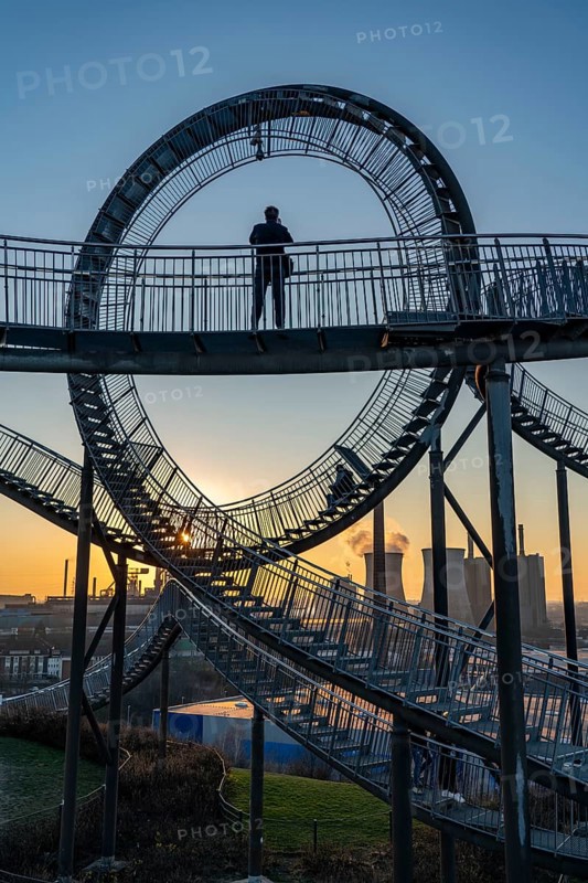 Landmark Angerpark Tiger & Turtle, Magic Mountain, walk-in sculpture in the form of a rollercoaster on the Heinrich-Hildebrand-Höhe spoil tip, HKM steelworks, sunset, Duisburg, North Rhine-Westphalia, Germany, Europe
