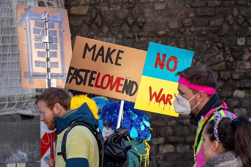 Peace demonstration against the war in Ukraine, instead of the Rose Monday parade in Cologne, with over 250, 000 participants, in the city centre, with many carnivalists, North Rhine-Westphalia, Germany, Europe