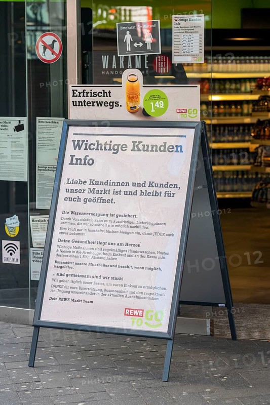 Effects of the coronavirus crisis, empty shopping street, notice at a food market, Hohe Straße in Cologne, Germany, Europe