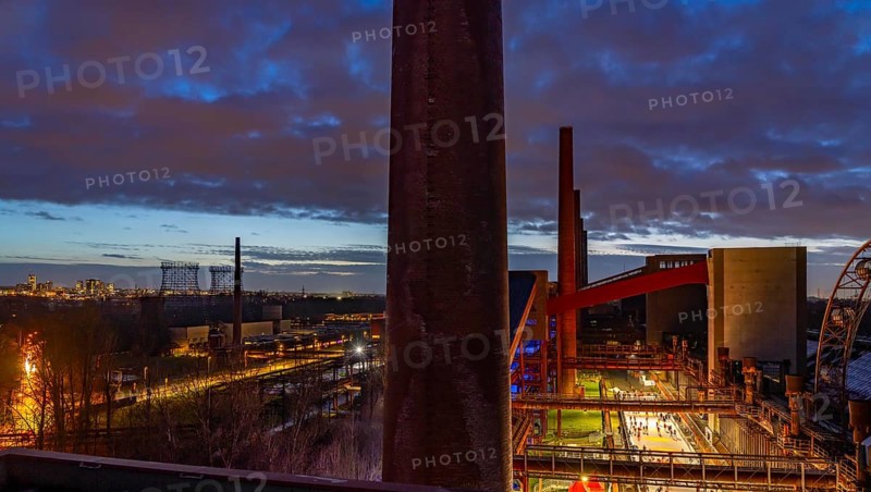 The ice rink at the Zollverein coking plant, Zollverein Coal Mine World Heritage Site, on the left the skyline of Essen city centre, North Rhine-Westphalia, Germany, Europe