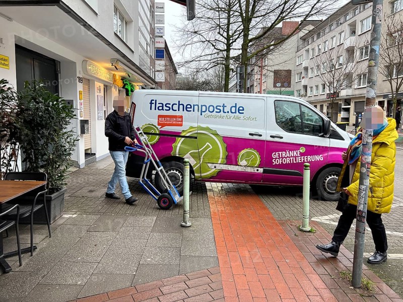 Delivery vehicle of the delivery service Flaschenpost.de parks on a pavement during delivery, Essen, North Rhine-Westphalia, Germany, Europe